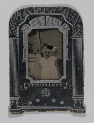 Tintype of a young girl in a paper radio frame