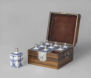Chest with nine bottles