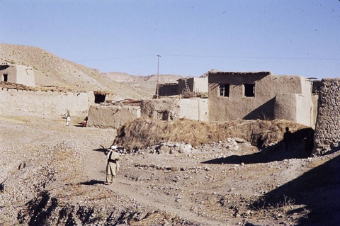 A color photograph of an angular adobe home on the outskirts of Kabul, Afghanistan. 