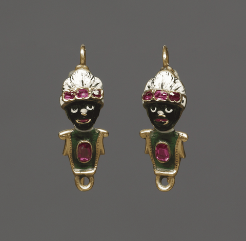 The heads of this pair of earrings are in the form of Africans wearing turbans. Their chests are enameled green, three small ruby pastes are set in the rims of each of their turbans, and larger oval ruby pastes are mounted in their chests.

