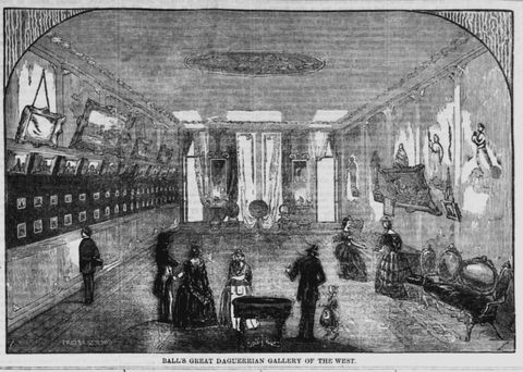 Black and white illustration of James Presley Ball’s Cincinnati art gallery. Framed artwork lines the walls of the gallery as a group of visitors looks on.