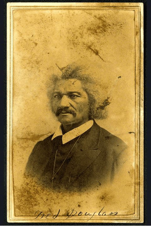 Carte-de-visite studio portrait of Frederick Douglass, pictured from the chest up wearing a dark suit.