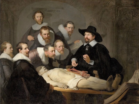 An oil painting depicts a group of men in frilly collars and beards gathering around a corpse, while one of them (wearing a hat) holds the tendons of the corpse’s arm with tongs.