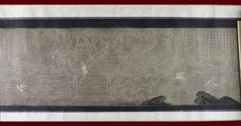 White outlines on gray paper show a group of ancient Chinese scholars sitting on mats along the banks of a river, with mountains in the background. Blocks of Chinese text are inscribed above their heads.