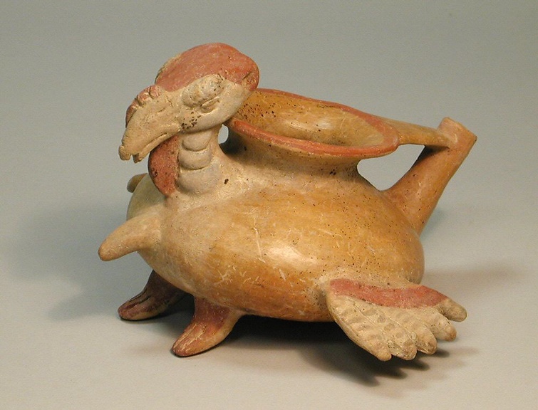 A round vessel in the shape of a male turkey.
